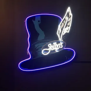 a neon hat with a feather