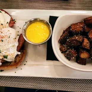Eggs Benedict and fried potatoes
