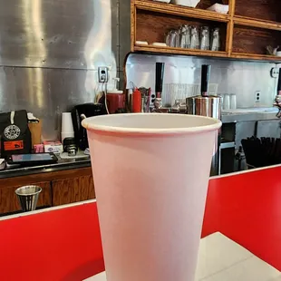 a plastic cup on a napkin
