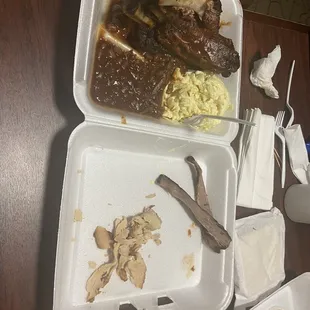 two takeout containers of food