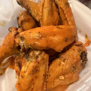 a plate of chicken wings