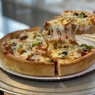 Deep dish cheese, sausage, green pepper and black olives.