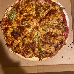 Thin crust pizza with onions and green pepper