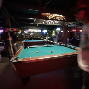 a pool table in a bar