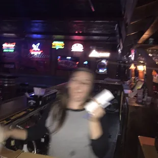 a blurry image of a woman playing a video game