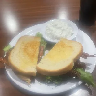BLT sandwich, on toasted white bread. With side of yummy cottage cheese