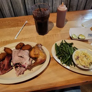 Three meat combo (sausage, pork, chicken) with tater salad and green beans.