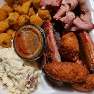 Dinner Combo Pick 2...ribs, brisket, potato salad,fried okra and hush puppies