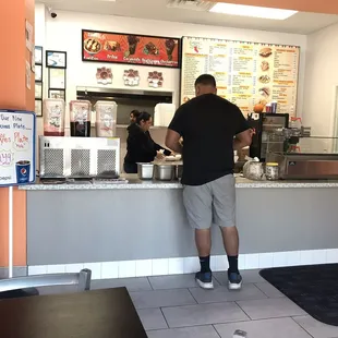 a man standing at the counter