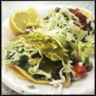 Ranchers steak tacos with red and green salsas. Delicious! Perfectly seasoned and spiced!