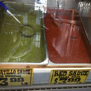 two trays of red sauce and green sauce
