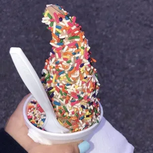 an ice cream cone with sprinkles