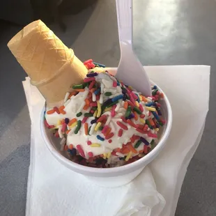 a bowl of ice cream with sprinkles