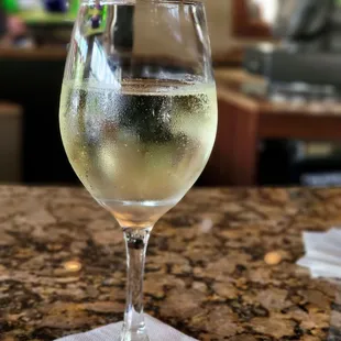 a glass of wine on a table