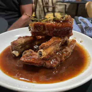 a plate of meat with sauce