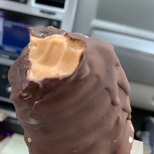 Tangerine soft serve or sherbert dipped in chocolate. One dip!