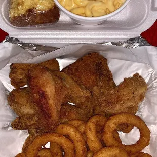 Fried chicken wings, onion rings, Mac n' Cheese, and cornbread