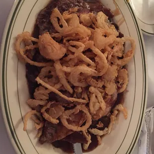 Ribeye with mushrooms and onion straws.