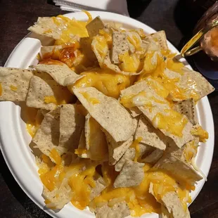 a plate of nachos on a table