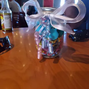 a jar of candy and a pair of scissors