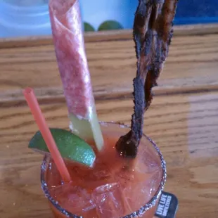 Bloody Mary w peppered bacon and salami cream cheese celery.