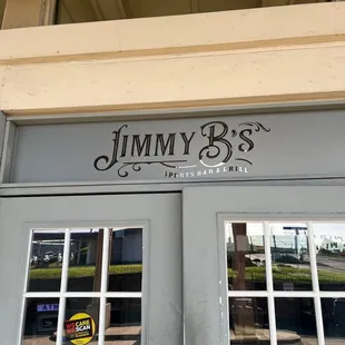 a reflection of a sign on the door