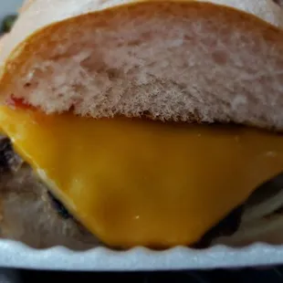 The cheeseburger is not on a bun but a fresh hoagie bread.