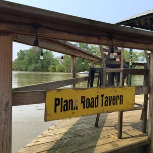 a sign that reads plan road tavern