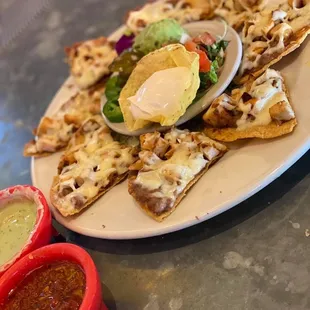 a plate of nachos and salsa