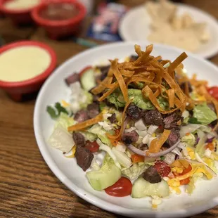 a plate of salad on a table