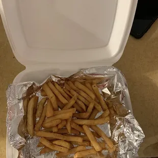 Big container with barely any fries.