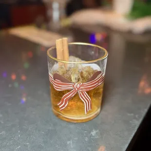 Bows Before Bros - bourbon, salted caramel whiskey, cocoa bitters, honey, vanilla, gold