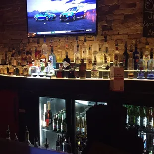 a bar with bottles of liquor