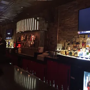 a bar with a television in the background