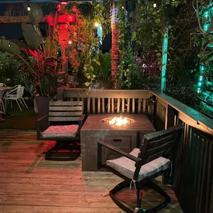 a patio with a fire pit