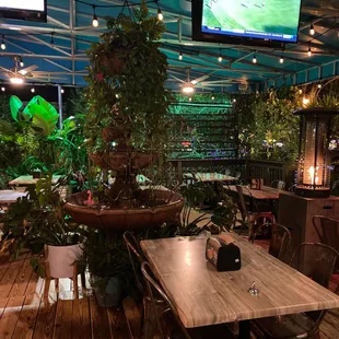 a restaurant with a large screen tv