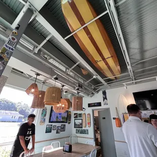 a surfboard hanging from the ceiling