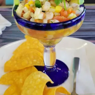 a plate of chips and a salad