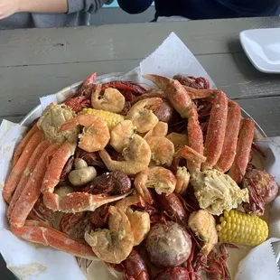 Ultimate Boil Crawfish, shrimp , snow crab , mushrooms, corn ,sausage and potatoes. Delicious.