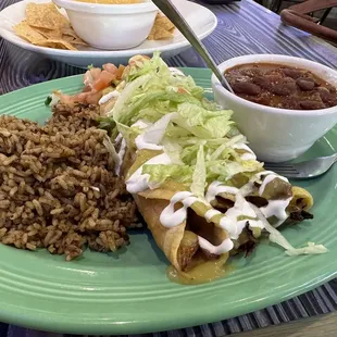 Chicken Tinga Flautas with dirty rice and red beans