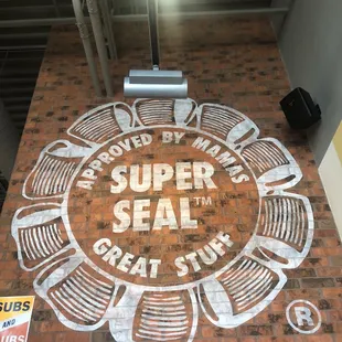 a sign for the super seal great stuff store