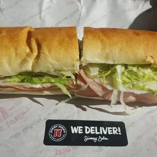 a sub sandwich with meat and lettuce