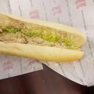 a sandwich with lettuce and meat