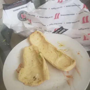 a half eaten sandwich on a plate