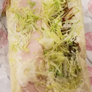 a sandwich with lettuce and meat