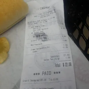 a receipt and a sandwich