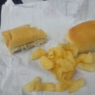 a sandwich and potato chips