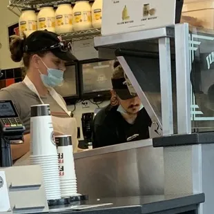 Making sandwiches and not wearing masks even though Harris County mandates it.