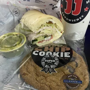 a cookie sandwich and a drink