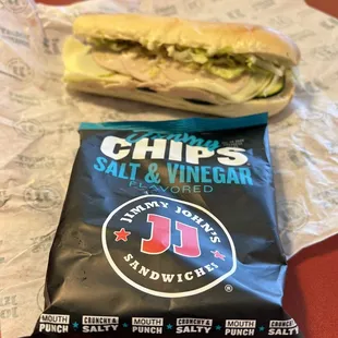 a bag of chips and a sandwich